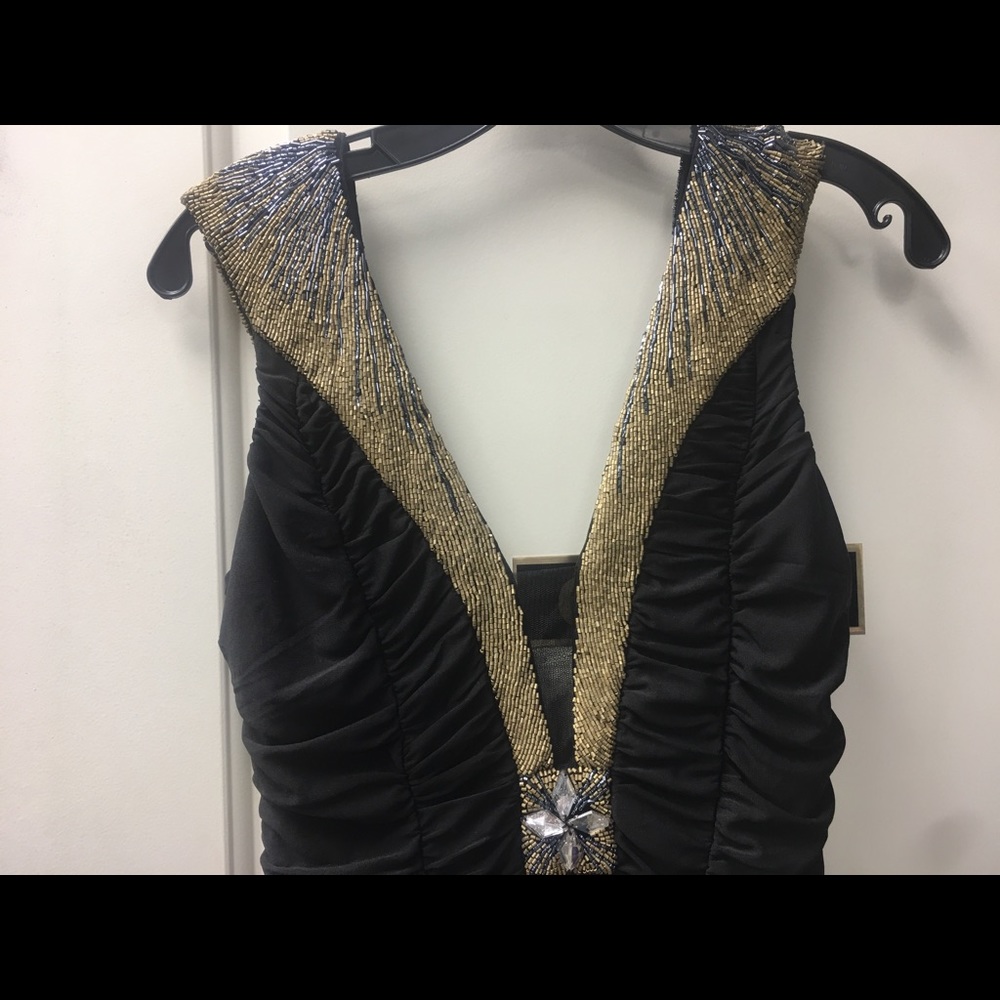 Mini Stretch black dress with gold neckline